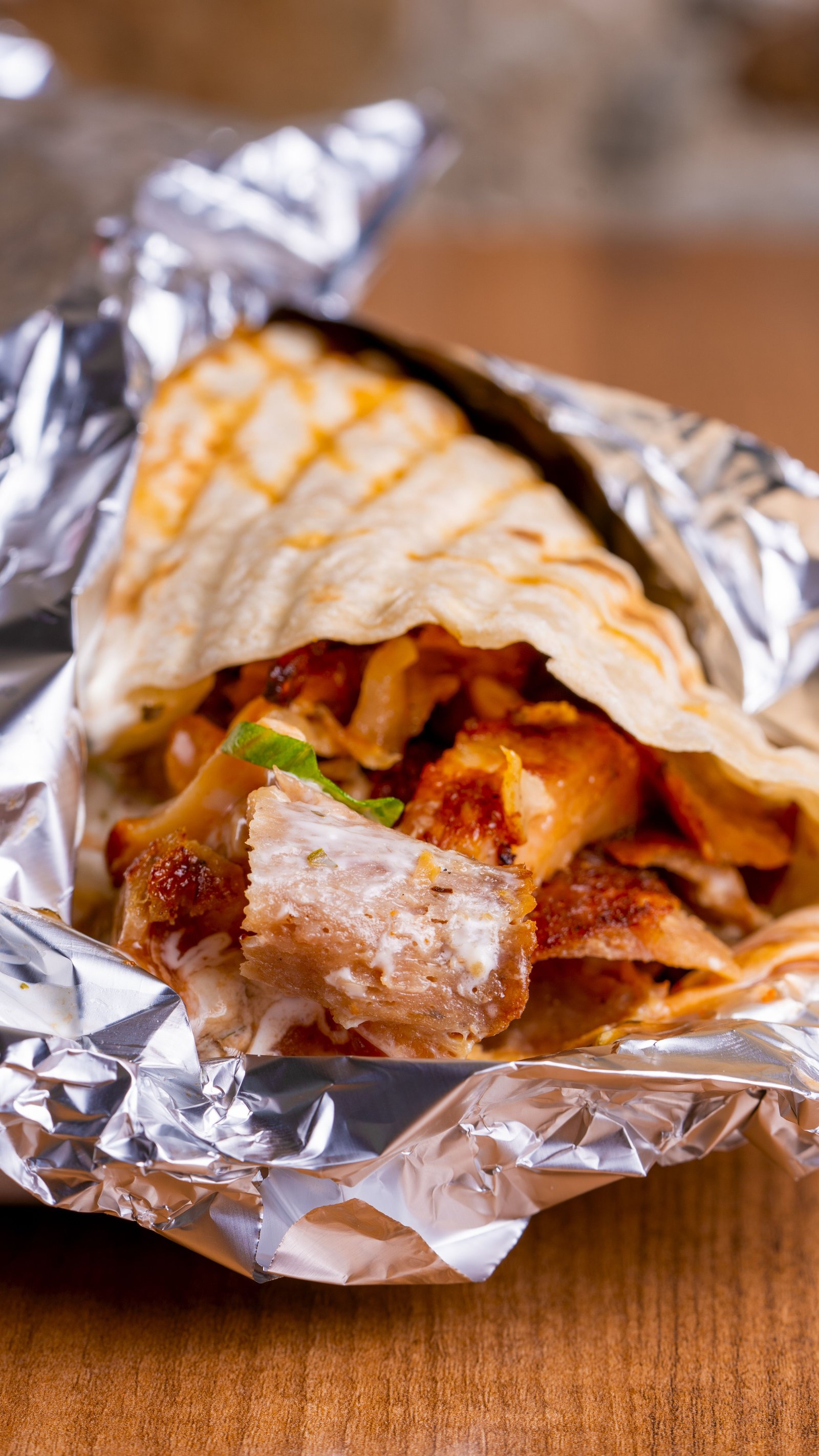 Chicken shawarma wrap sliced in half
