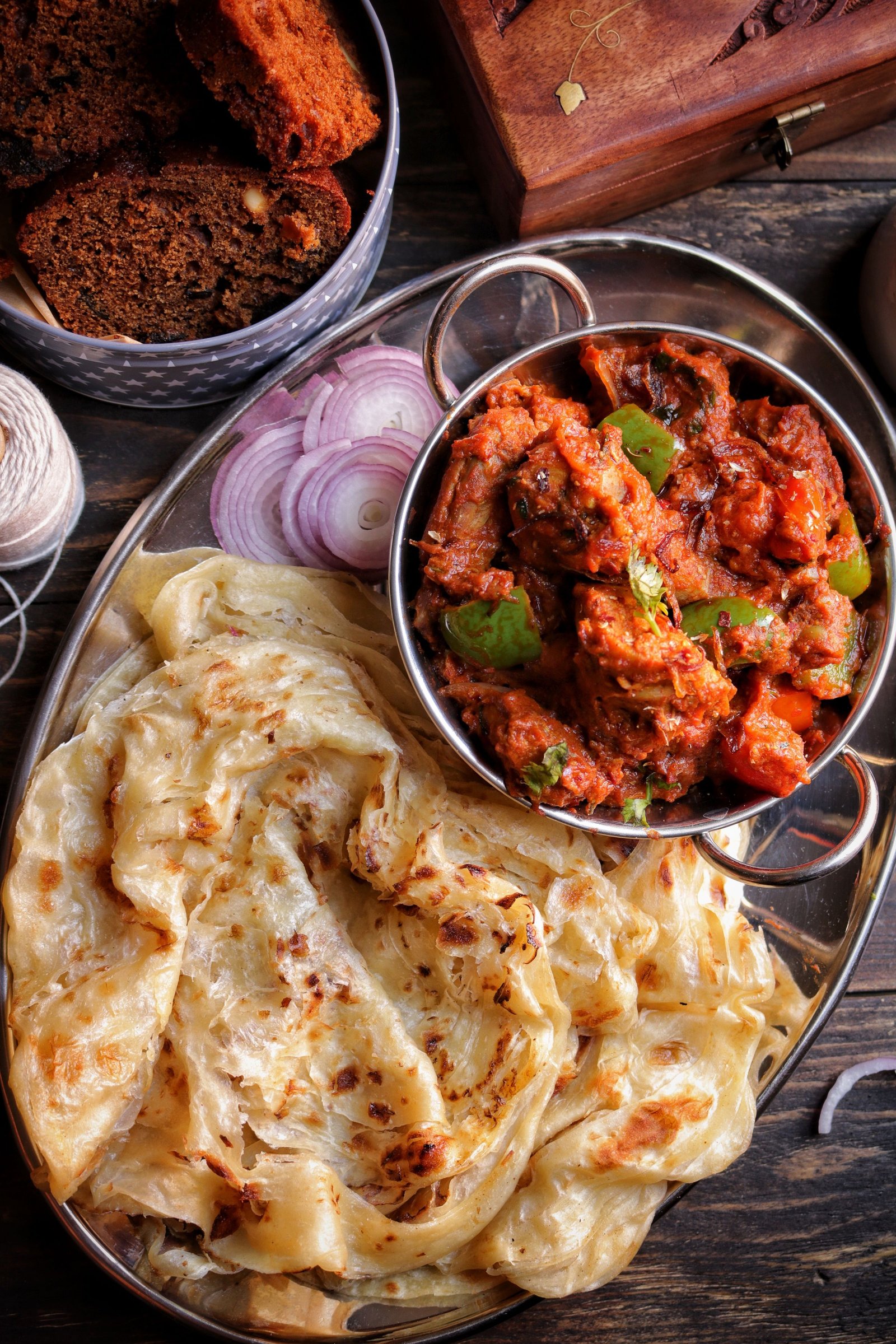 Chicken kothu parotta with spicy curry