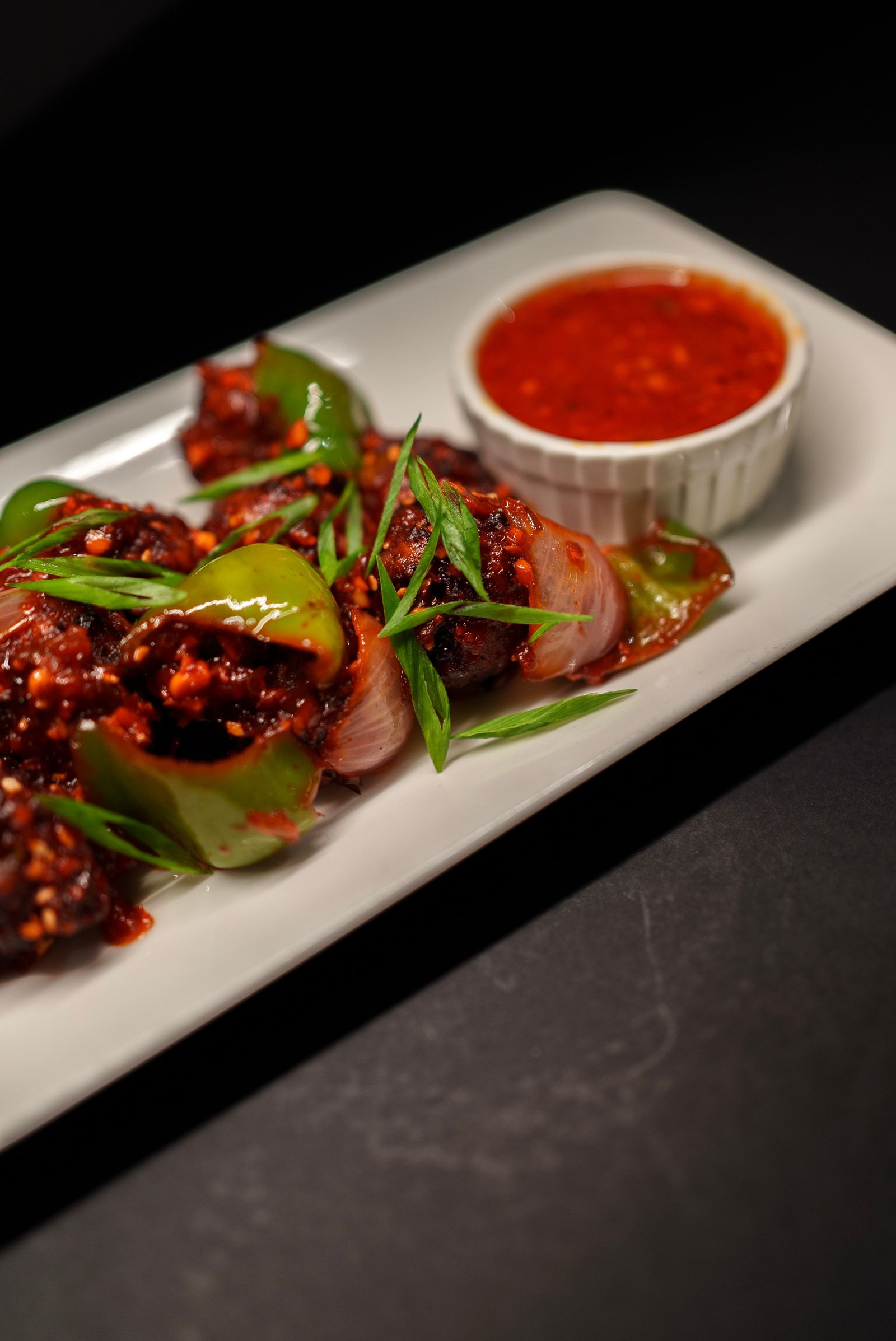 Indo-Chinese chilli chicken with spring onions