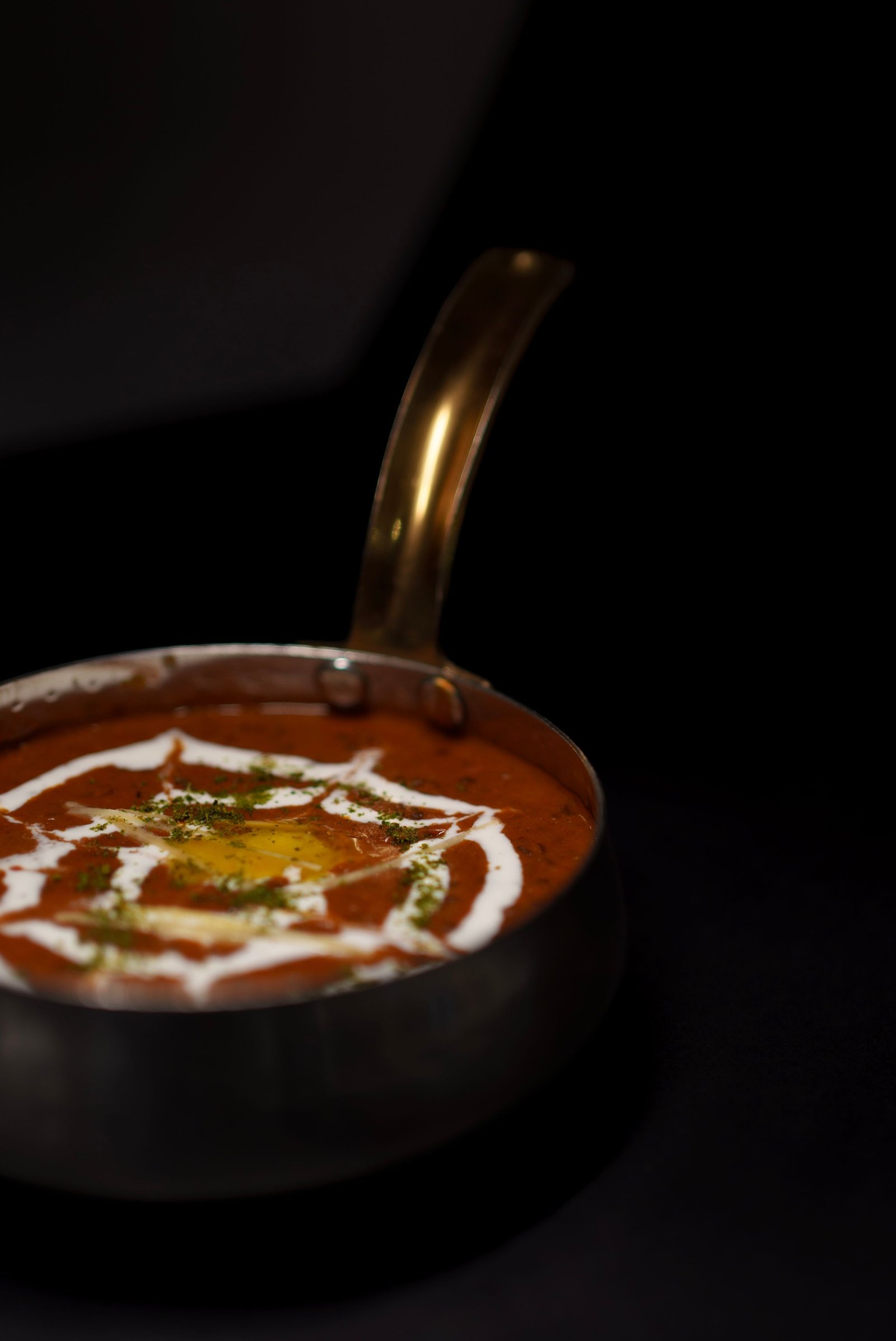 Creamy dal makhani in a brass bowl
