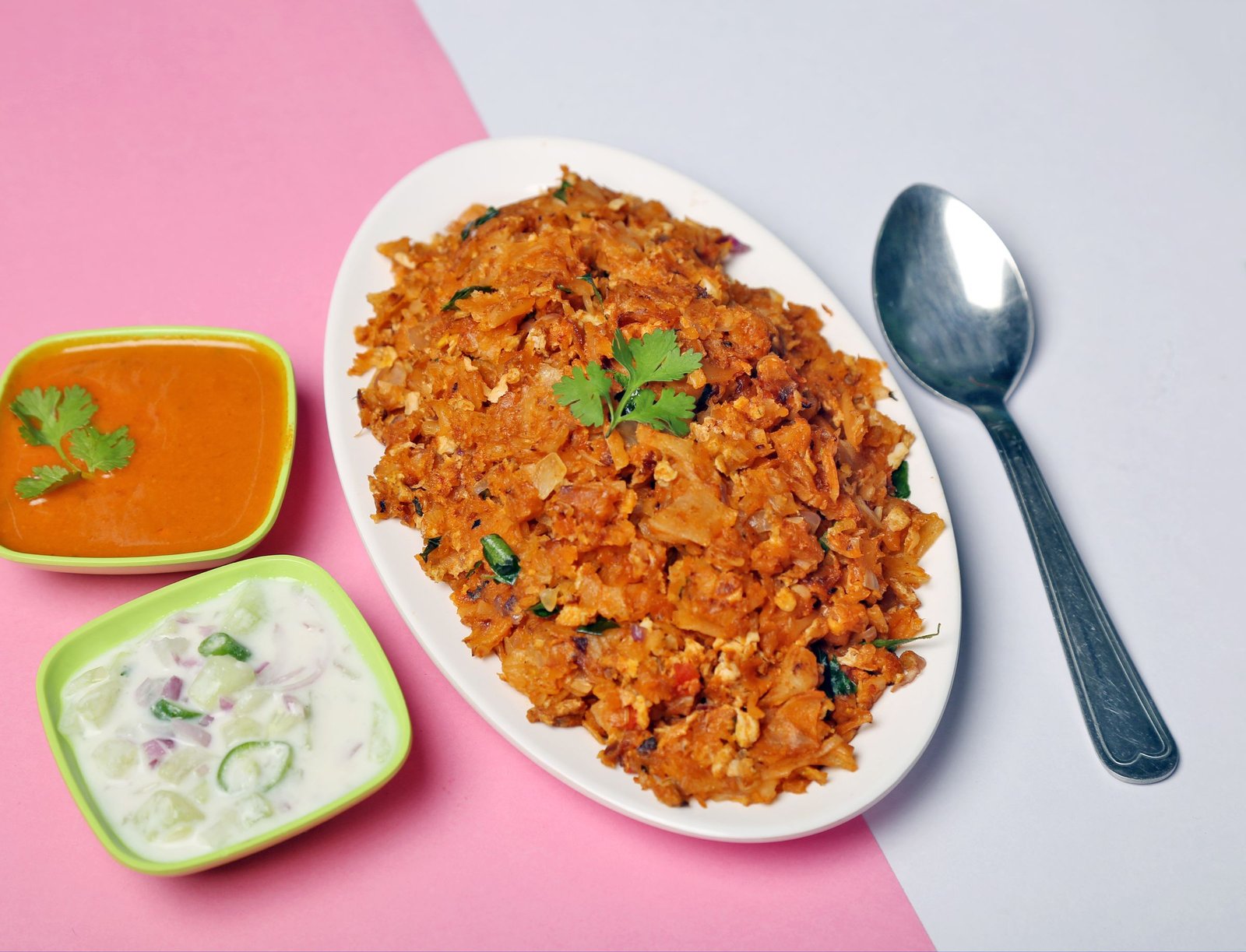 Egg kothu parotta with curry and raita