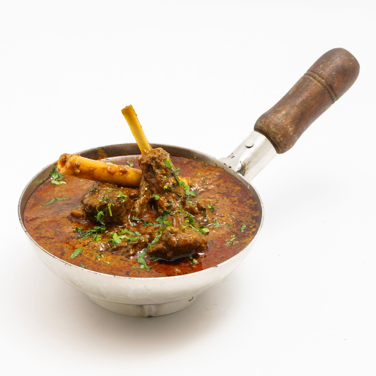 Mutton curry in a traditional pan