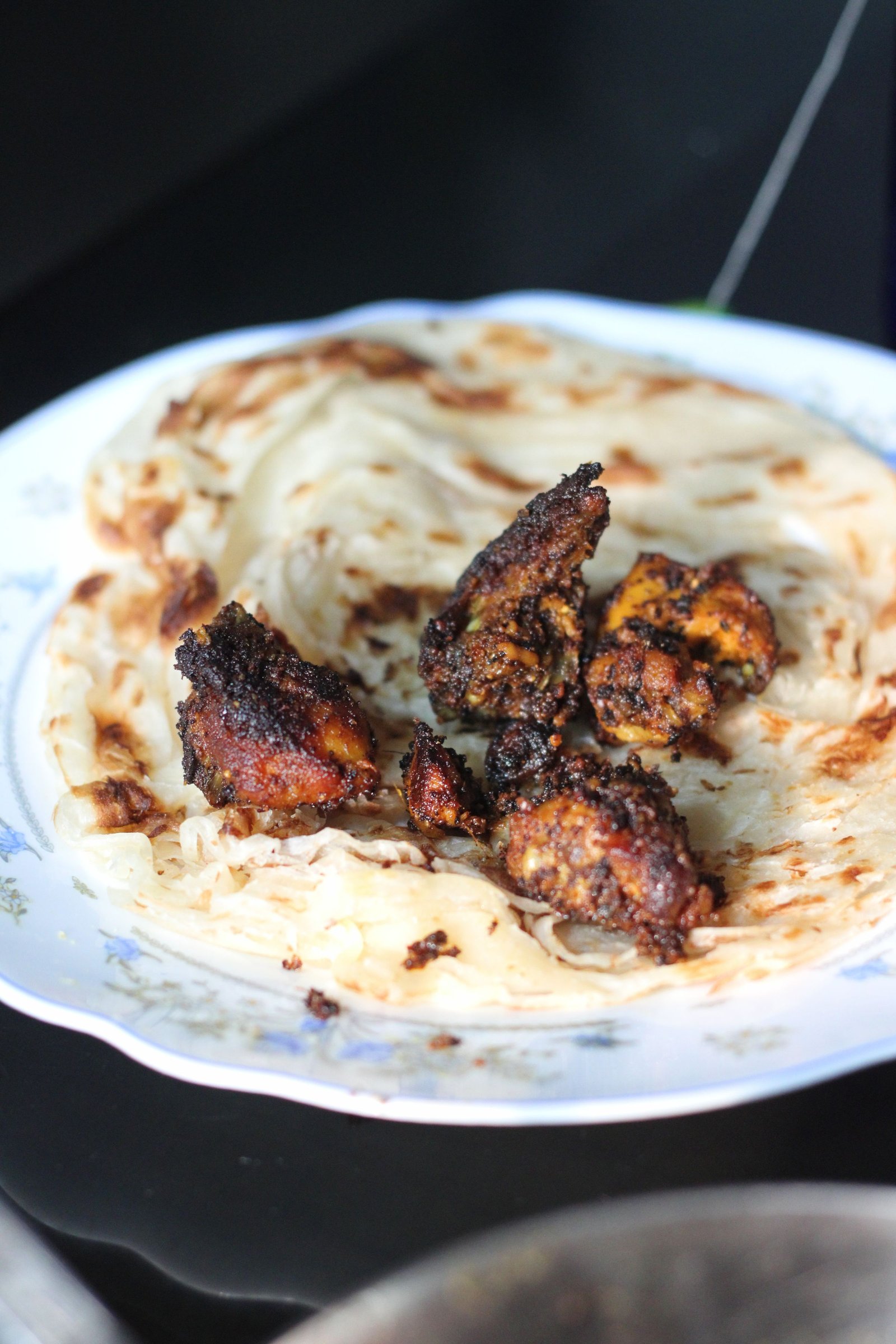 Kothu parotta with grilled meat